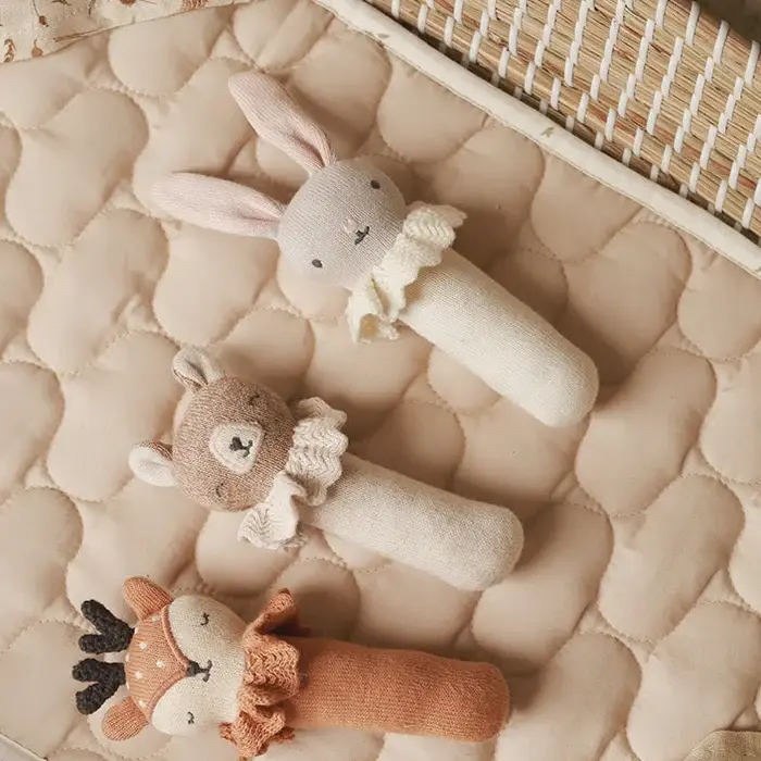 Thumbnail: taupe bunny comforter and rattle gift set for a newborn baby, styled inside a natural wicker Moses basket with a white muslin