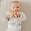 Thumbnail: Fox and Lottie organic cotton newborn babygrow in animal print at Seb and I