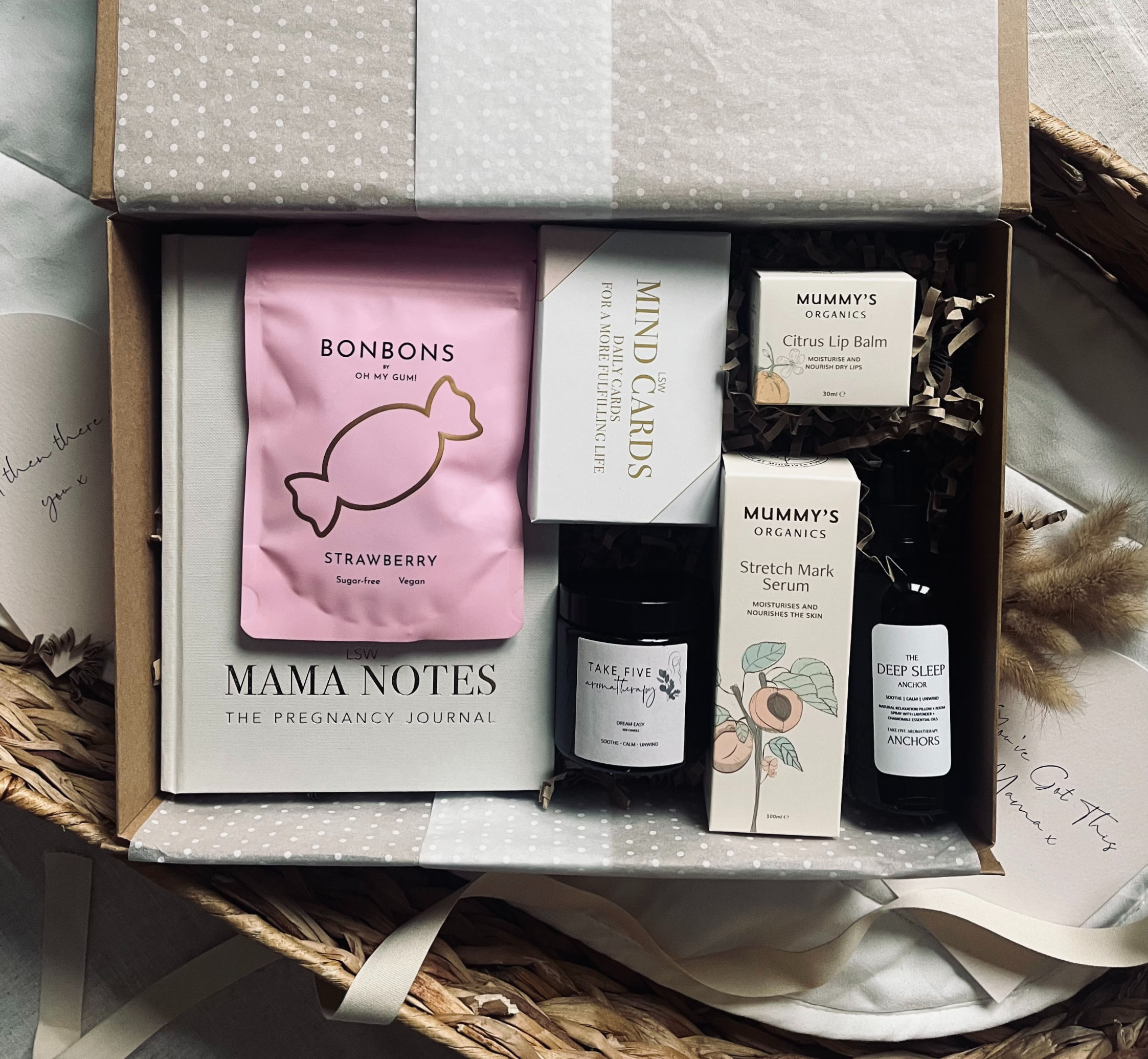 pregnancy gift box featuring LSW Mama Notes journal, LSW Mind Cards, OH MY GUM Strawberry Bonbons, Mummy's Organics Stretch M