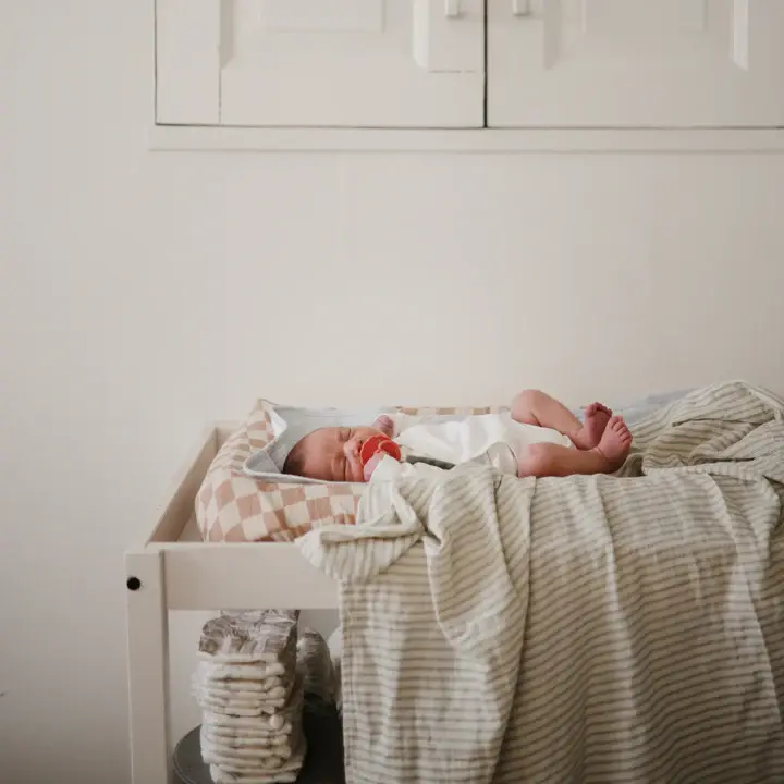 Sage stripe Mushie swaddle at Seb and I