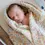 Thumbnail: Mushie baby girl swaddle in pastel bloom from Seb and I