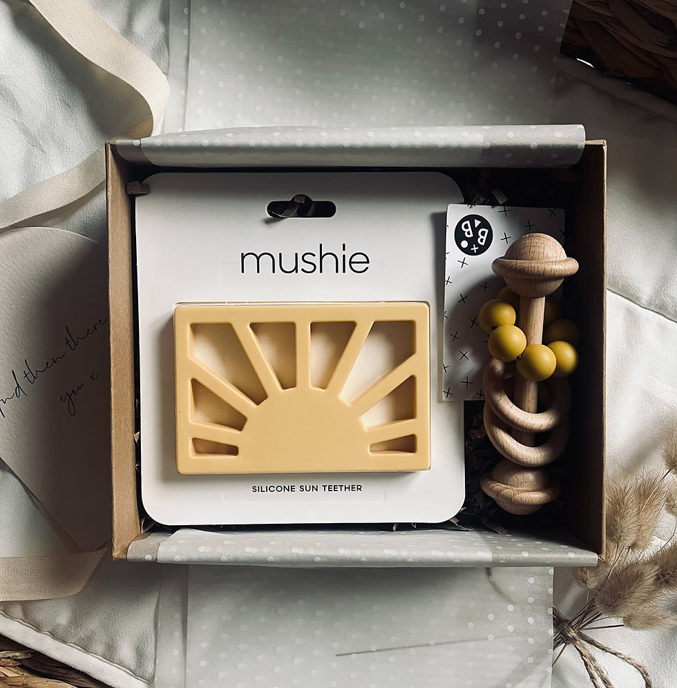 Neutral baby gift set with silicone teether and wooden rattle