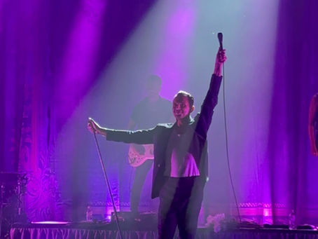 Theo Hutchcraft performing on stage during the Hurts concert at Sigulda Medieval Castle as part of the 15 Years of Happiness Tour 2025