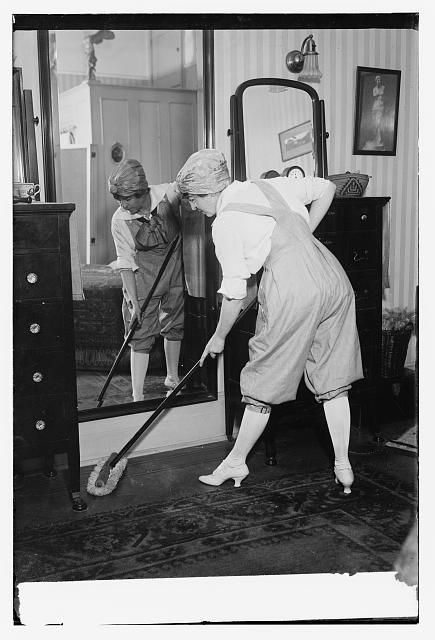 Maud Powell is cleaning a room