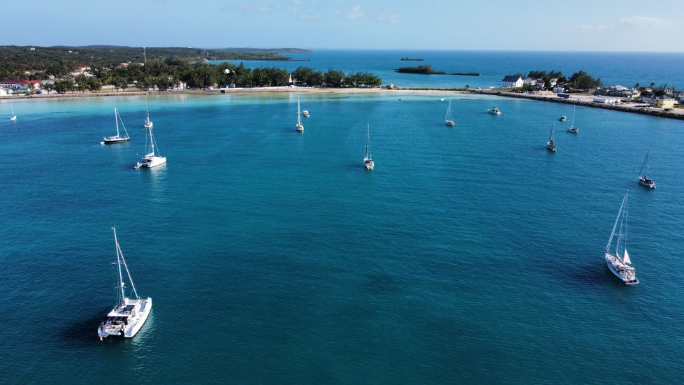 Sailers dock at the famous Cupids Cay for warm summers