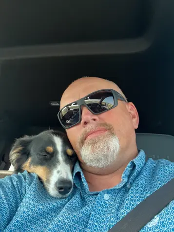 Tracy and dog in car.webp