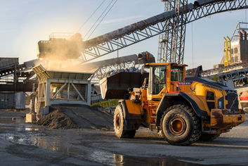 Maritime Infrastructure: Front-loader loading ore onto a ship at Sheet Harbour - Nova Scotia
