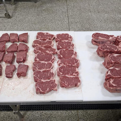 Fresh steaks on cut table.jpeg
