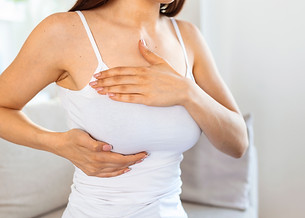 young-caucasian-woman-palpating-her-breast-by-herself-that-she-concern-about-breast-cancer