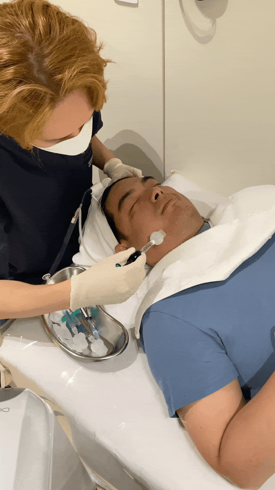 GIF of a skin booster treatment being performed in a Korean dermatology clinic, showing close-up of the injection process with sterile equipment in a clean, bright treatment room