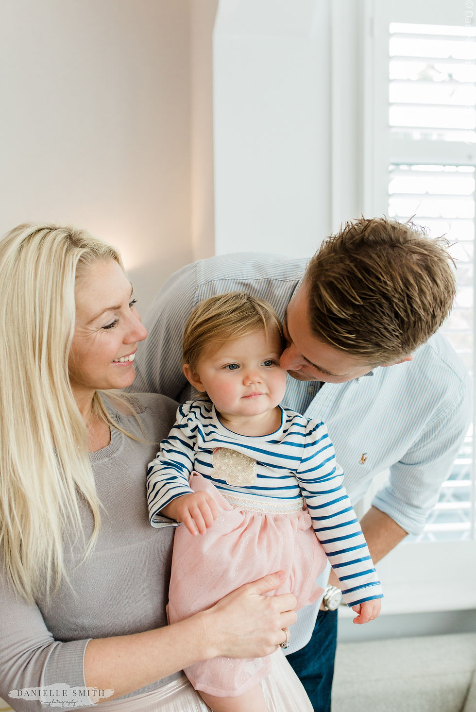 mum, dad and baby girl on her first birthday