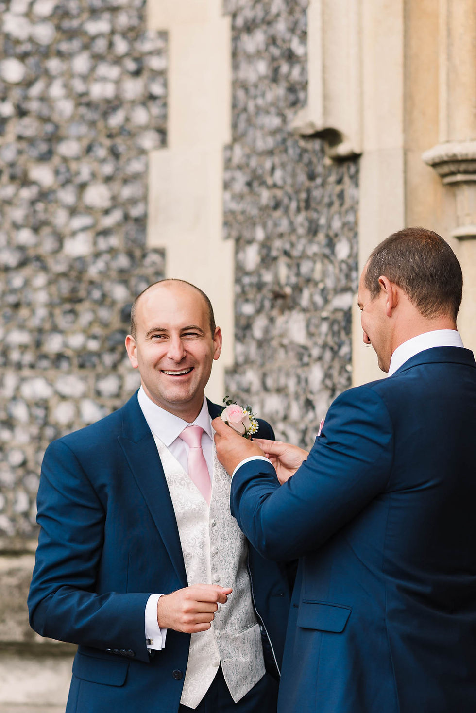 groom having his button hole put on