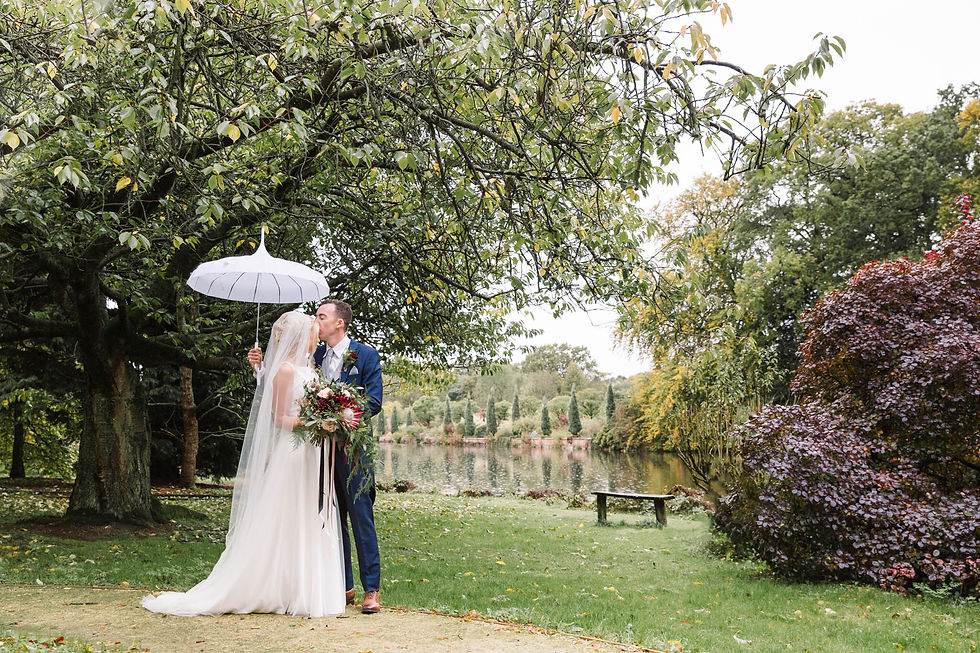 groom kissing brides forehead