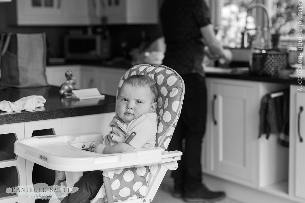 baby boy sitting in high chair