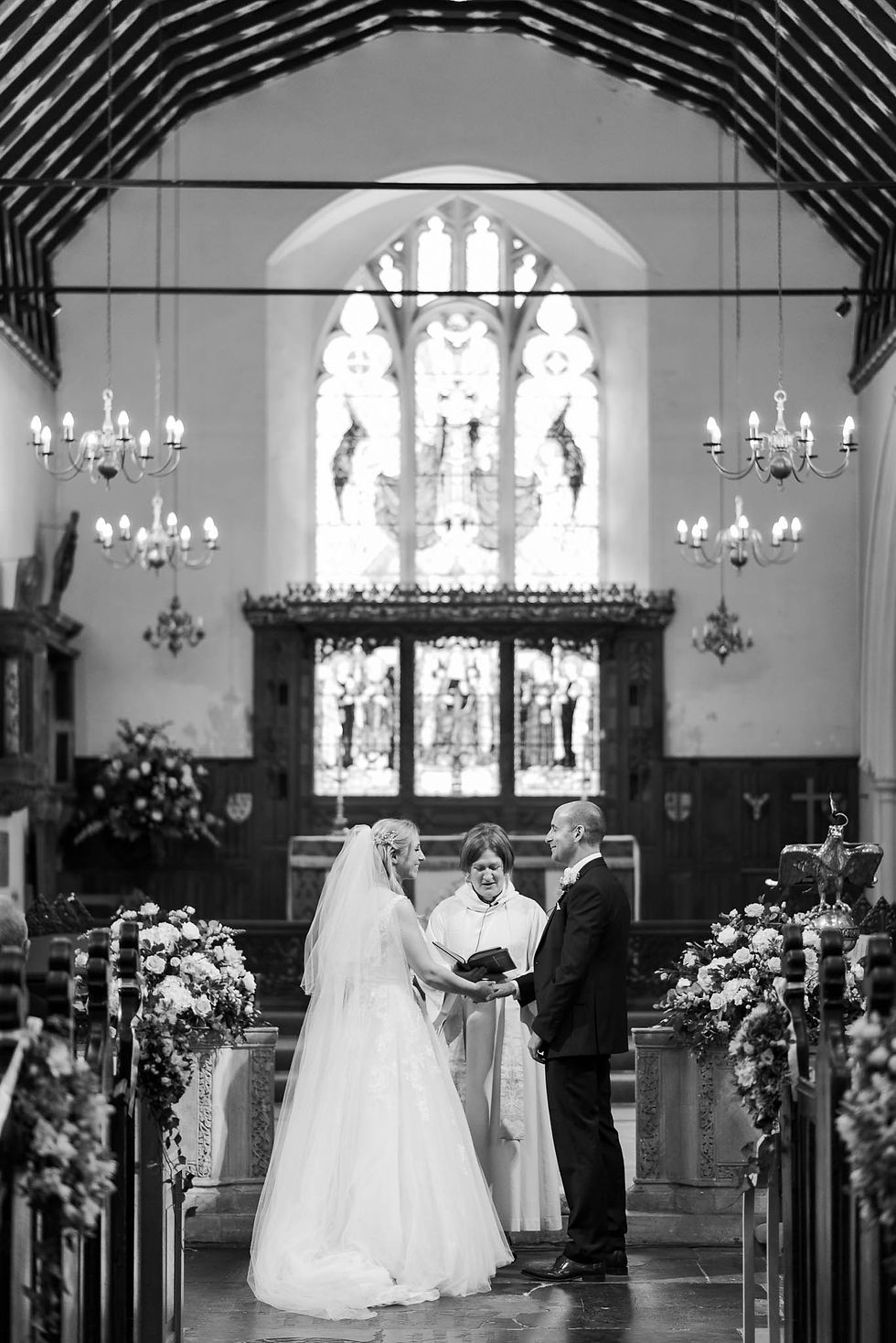 bride and groom during church ceremony - elegant london wedding