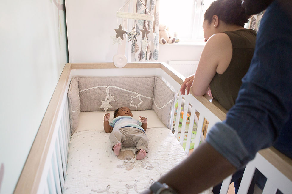baby boy laying in cot - lifestyle photography at home