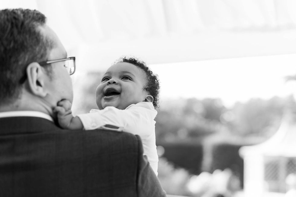 baby smiling at wedding