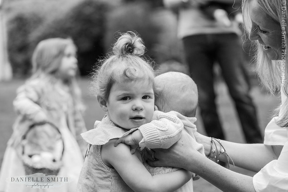 little girl cuddling her baby cousin