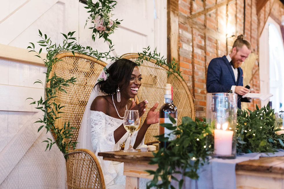 bride laughing at grooms speech