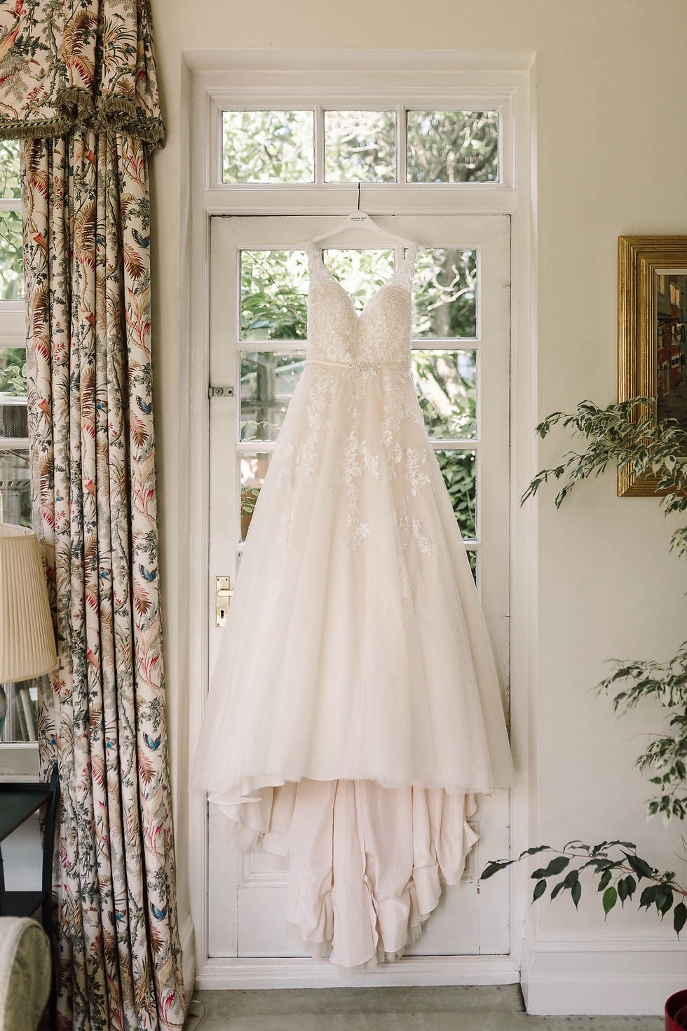 kenneth winston wedding dress hanging up