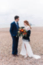 bride and groom on brighton beach winter wedding
