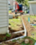 tubing for drainage in a trench along a house 