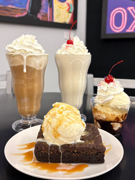 Desserts -- a root beer float, malt, Sunday and brownie with ice cream.