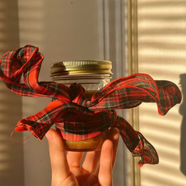 Jar of maple caramel with a christmas bow