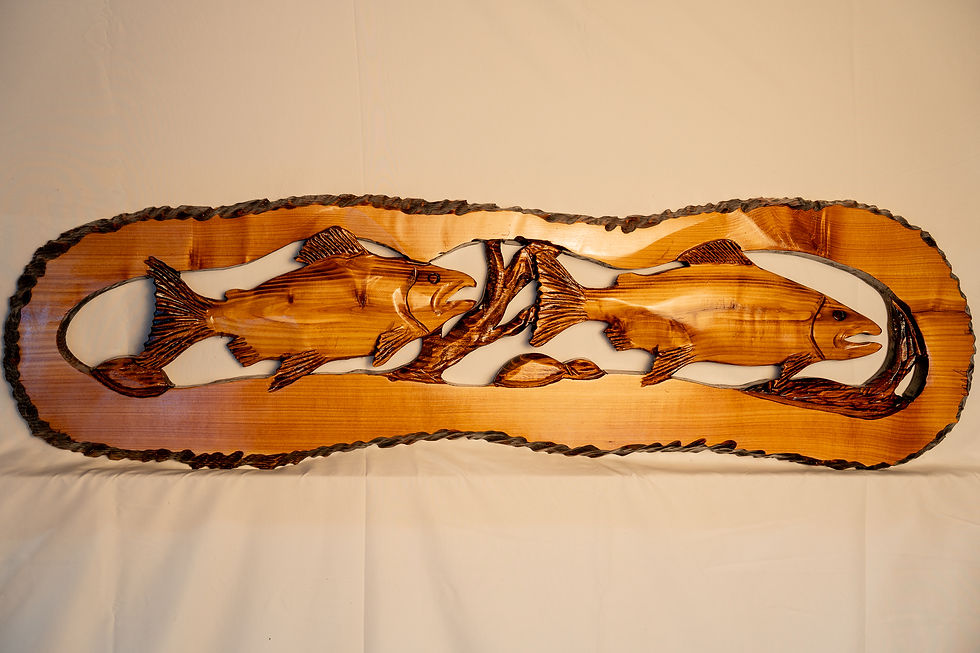 Featuring salmon swimming through a forest creek, this carving brings together the rugged beauty of water and wildlife.