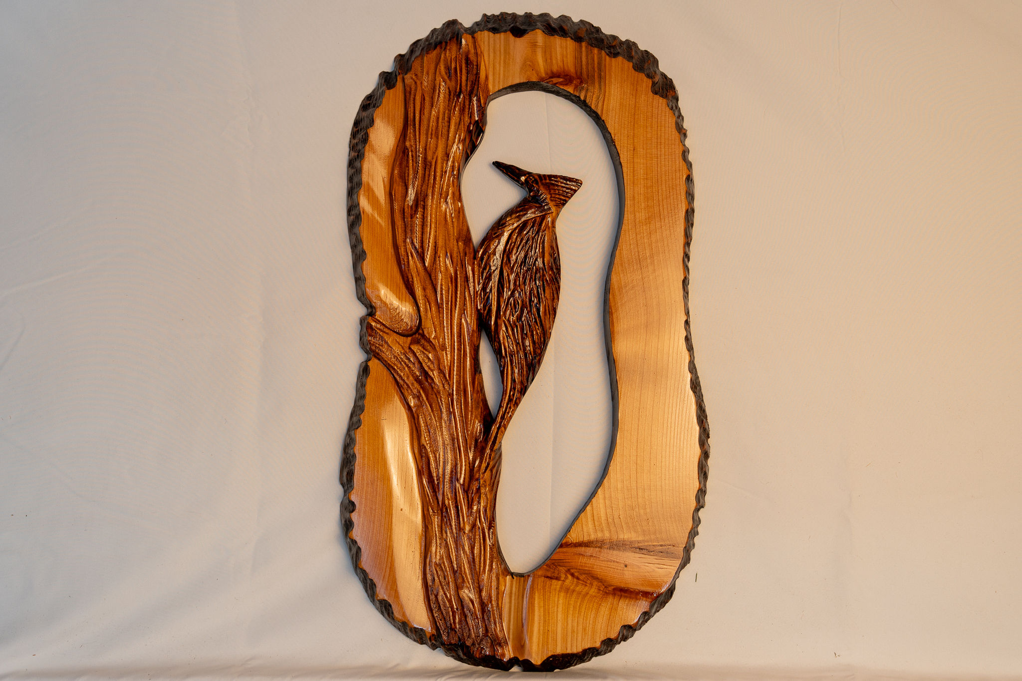 Inspired by the birds of the PNW forests, this woodpecker carving adds natural rustic charm to cabins, homes, and outdoors