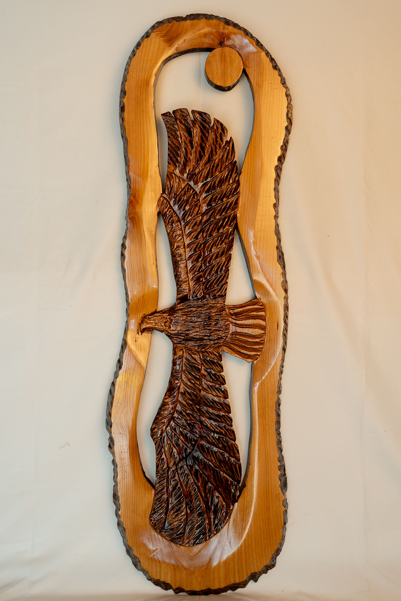Inspired by the mountains, forests, and waterways of the Northwest, this soaring eagle carving captures the spirit of freedom