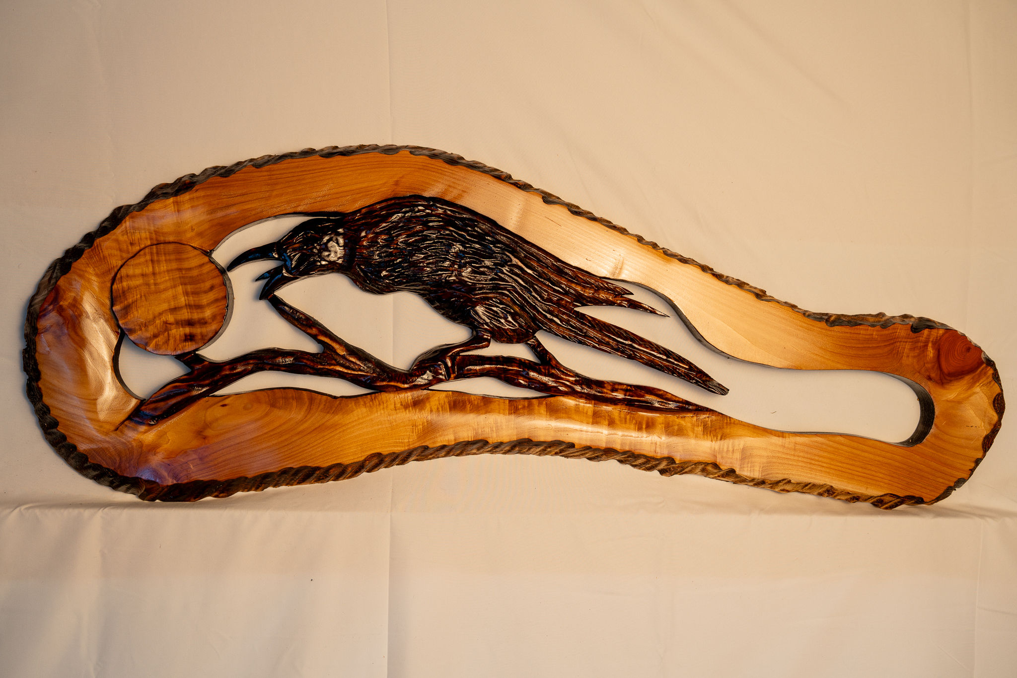 This hand-carved raven piece combines rustic artistry with the raw beauty of nature.