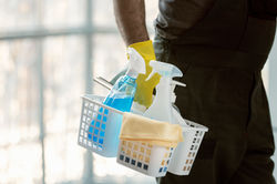 hand-holding-stand-with-cleaning-products