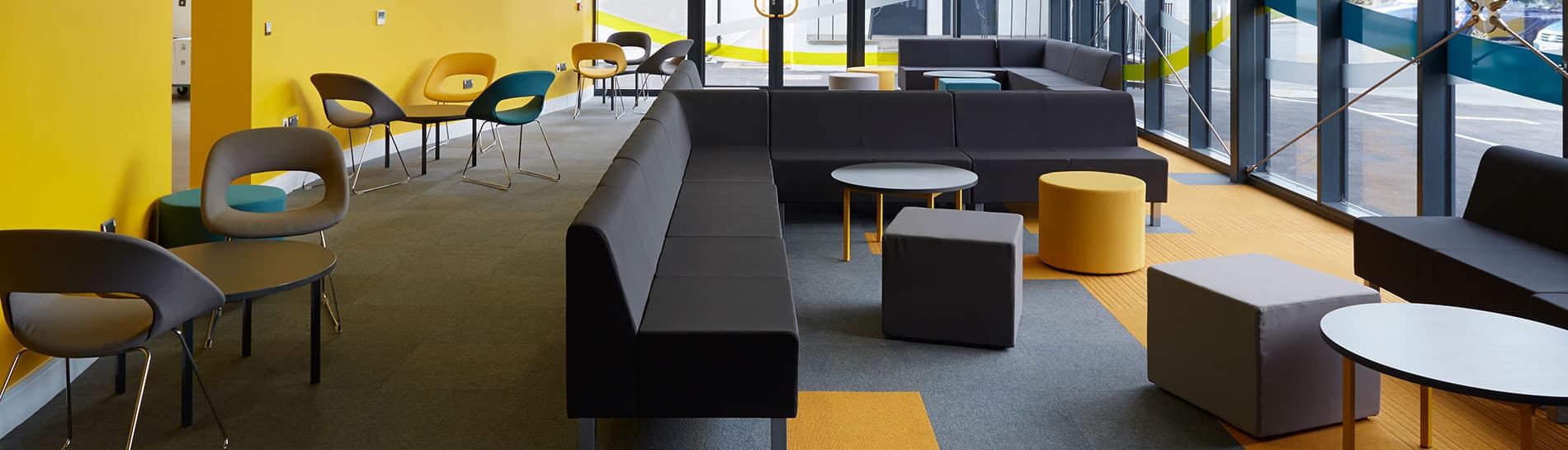 Burmatex school project showing grey flooring with bright yellow accents