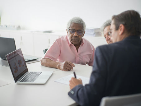 Senior couple meeting with advisor about Medicare options in Florida