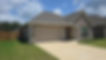Stone house with garage and gutters