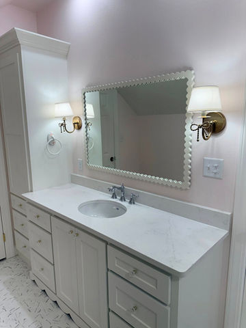 Bathroom vanity with mirror and sconces