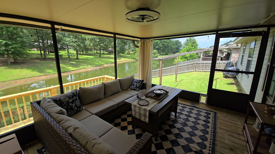 Screened porch overlooking peaceful lake