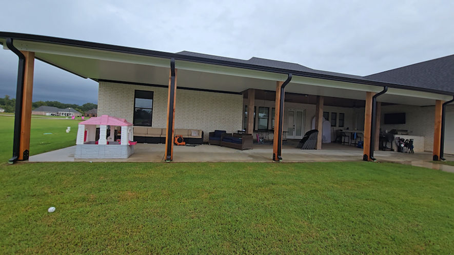 Covered patio with wooden posts and seating