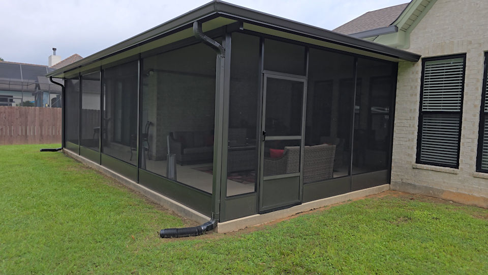 Screened patio addition attached to house