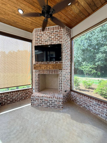Outdoor fireplace by a custom home builder.