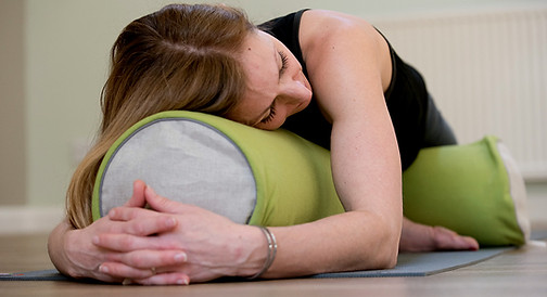 Kate Anderson sittin in yoga pose