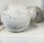 Small-ceramic-pot-on-a-shelf