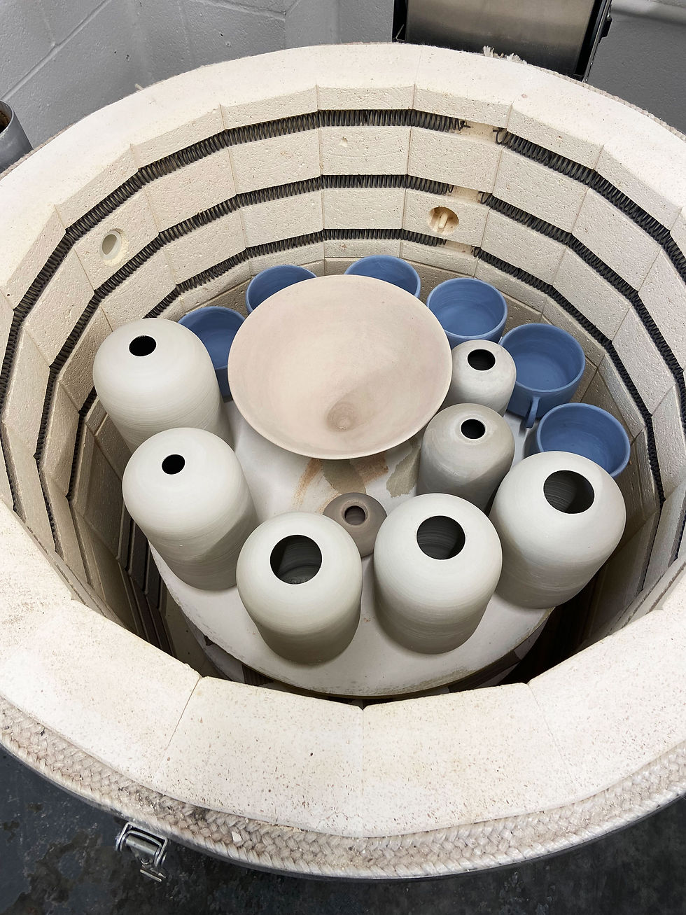 Pots-ready-to-be-fired-in-a-kiln