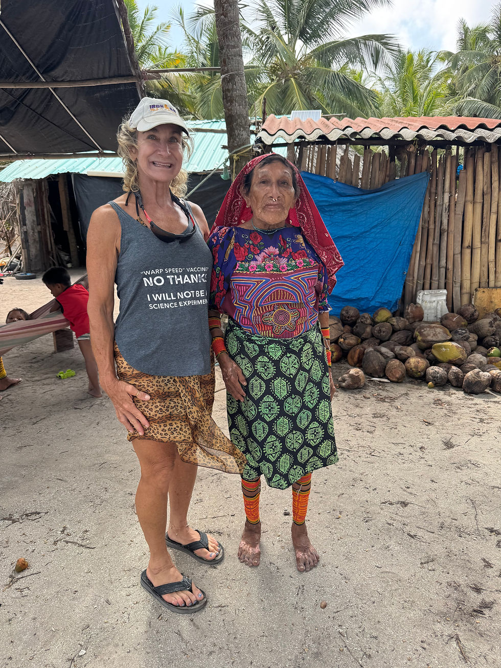 Bridgette is 79 years old and proudly wears one of her handmade Mola shirts and sports the standard nose ring.