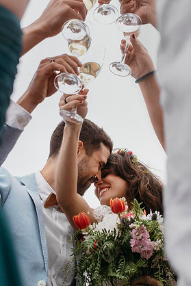 people-celebrating-with-their-friends-getting-married-beach.jpg