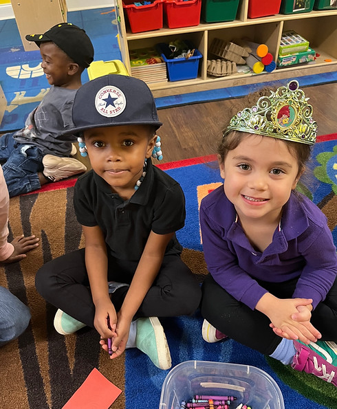 2 Kids posing for hat day with their hats on