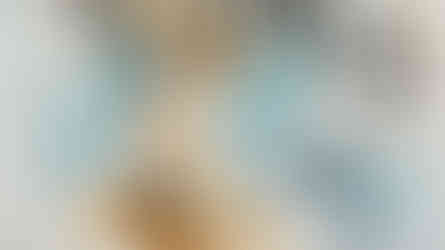 a painting of a statue of a woman sitting on top of a book