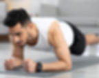 A person doing a plank exercise to strengthen core muscles for spine support.