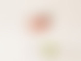 Pink cosmopolitan mocktail garnished with fresh cranberries and a lime wheel